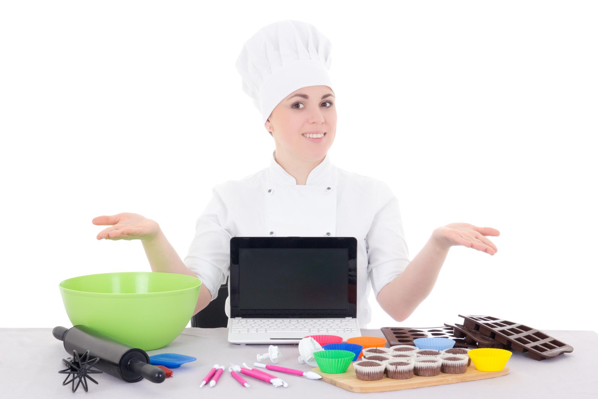 Hands plating a dessert during online lesson